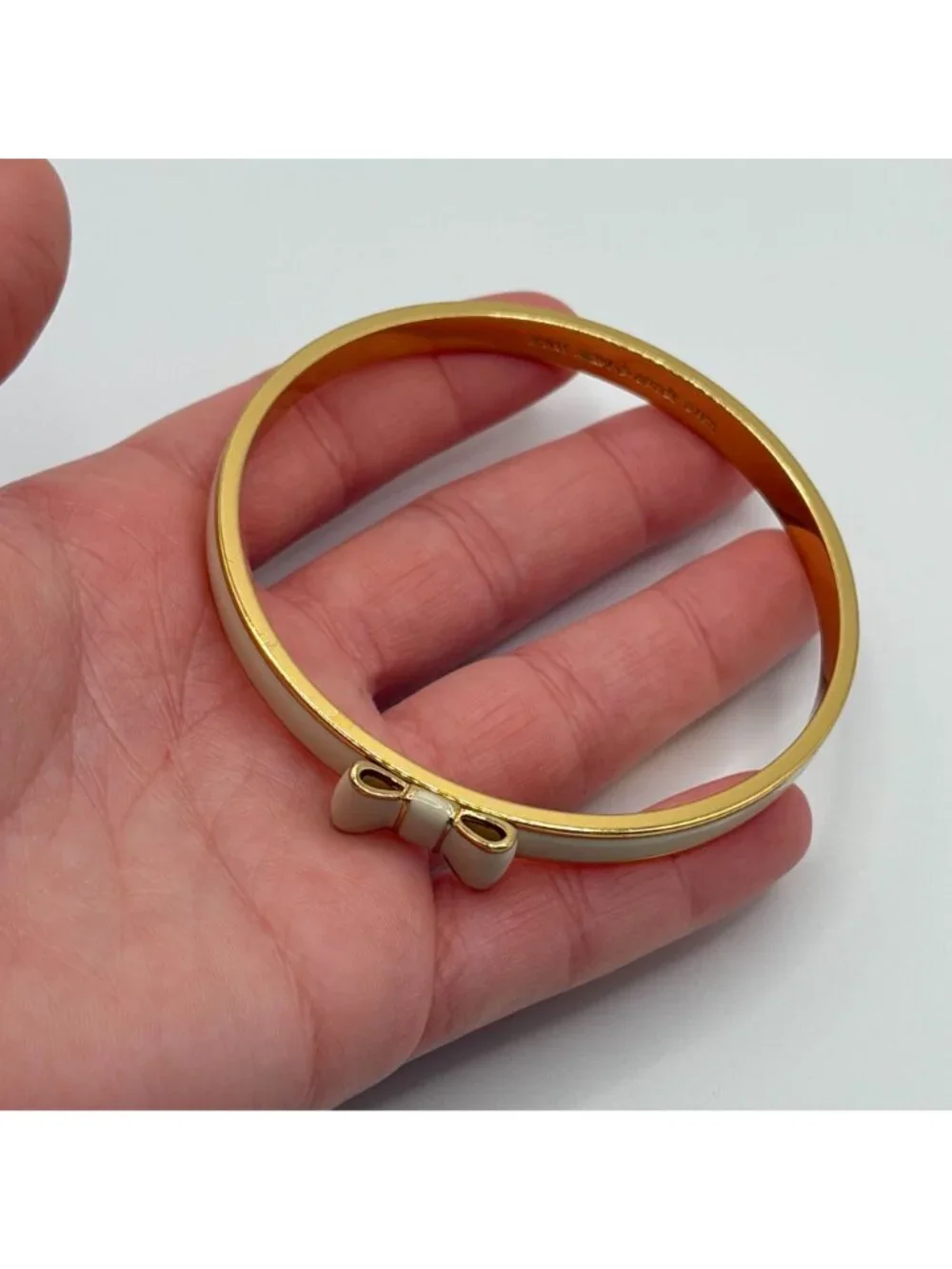 Kate Spade New York Cream Enamel Bow Gold-Tone Bangle Bracelet - Picture 4 of 4